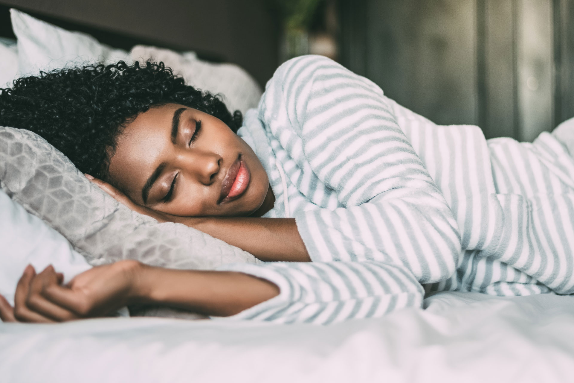 african american woman sleeping in bed